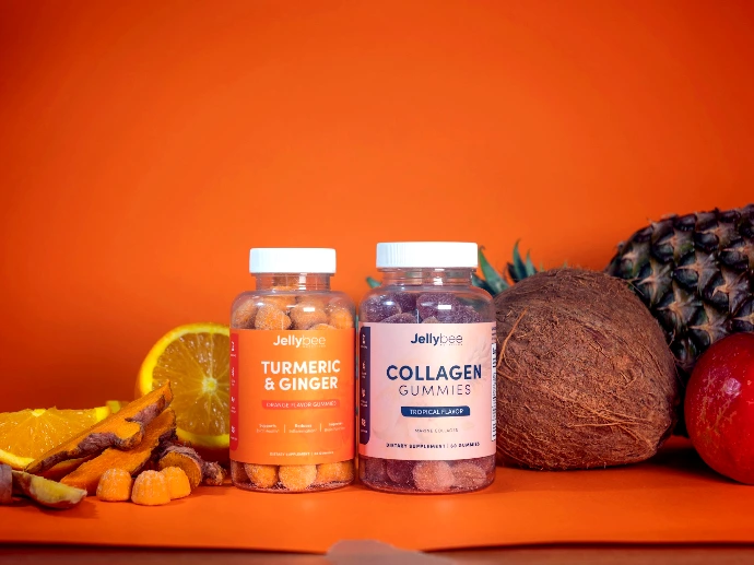 3 glass bottles on brown wooden table